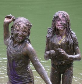 Girls having mud fight